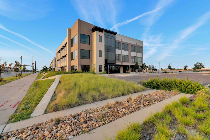 Modern dental office building at 4624 Central Park Boulevard in Denver with landscaped grounds.